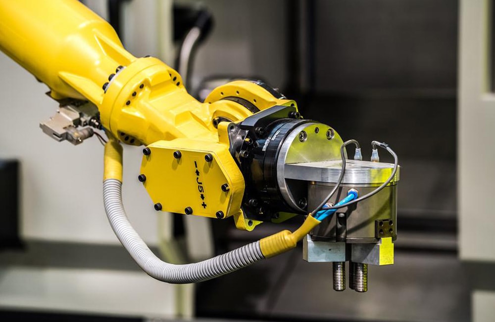 Orange industrial robotic arm automation